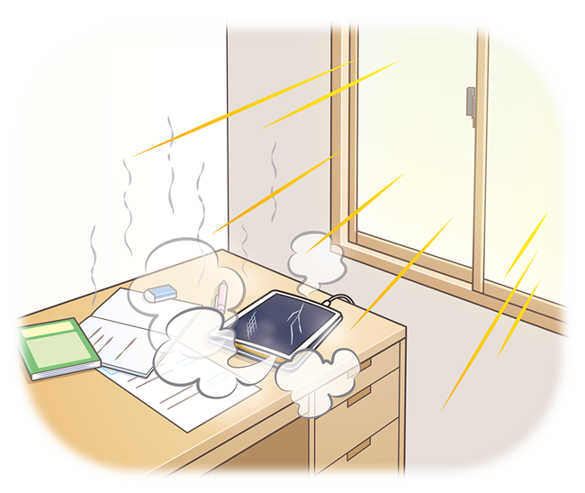 机の上のタブレットが日光にあたって過熱している